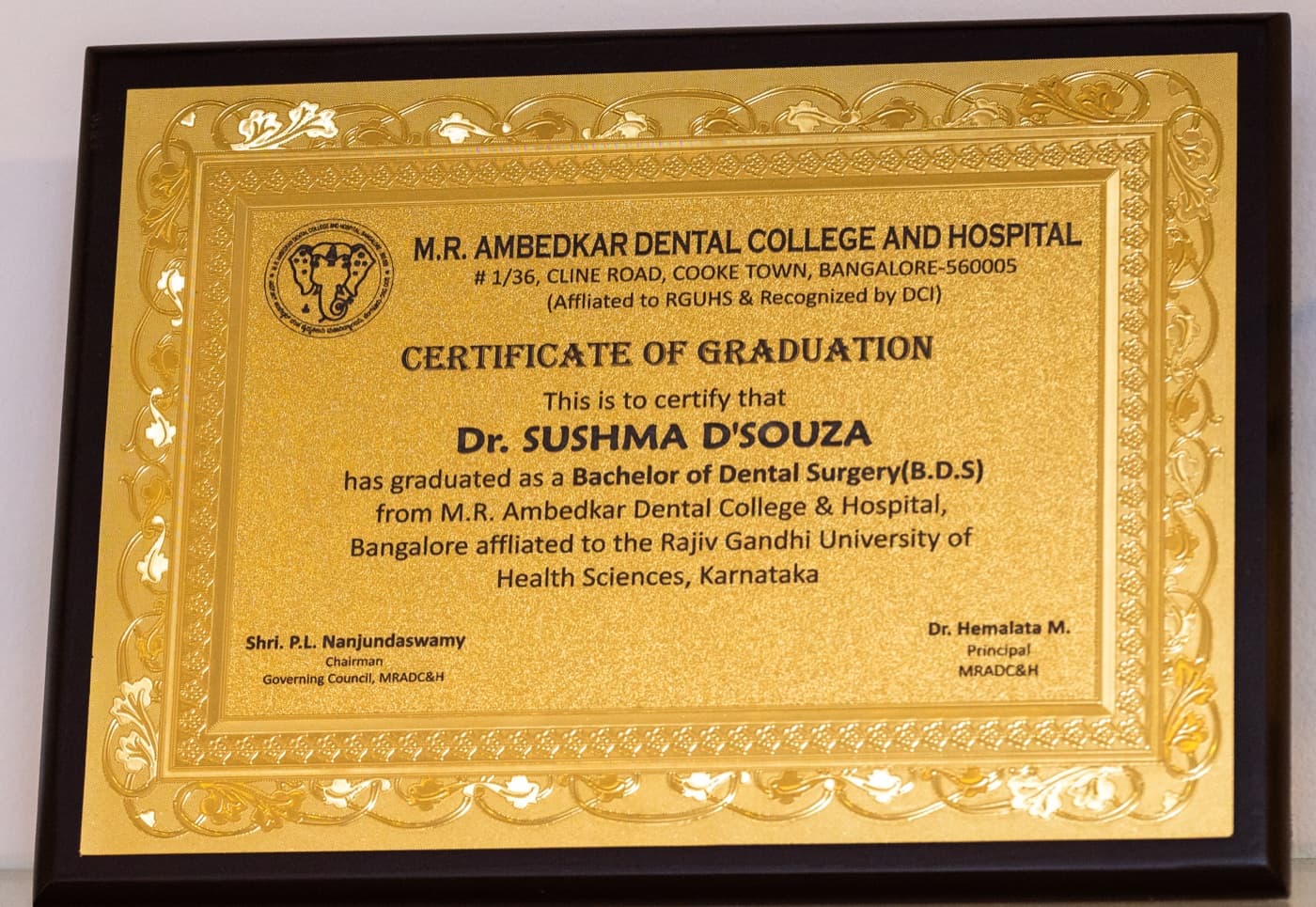 Dr. Sushma D'Souza's Bachelor of Dental Surgery graduation certificate from M.R. Ambedkar Dental College & Hospital